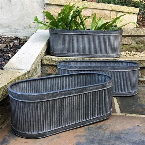 used galvanized trough planters